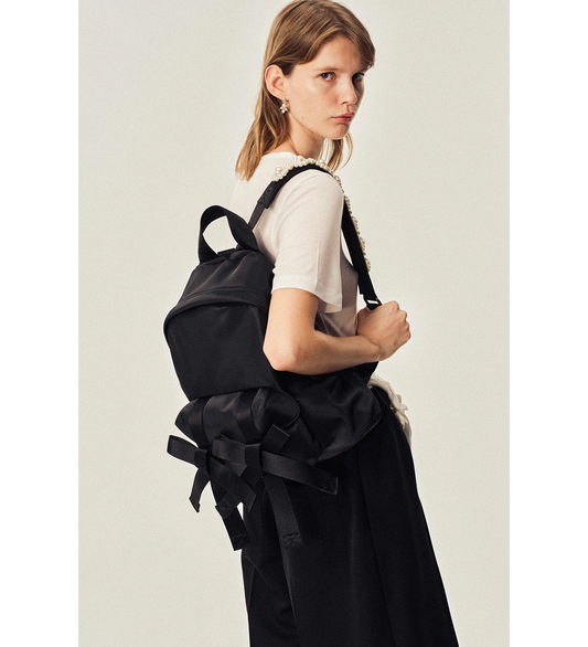 BOW FRONT BACKPACK W/EMB BLACK/PEARL